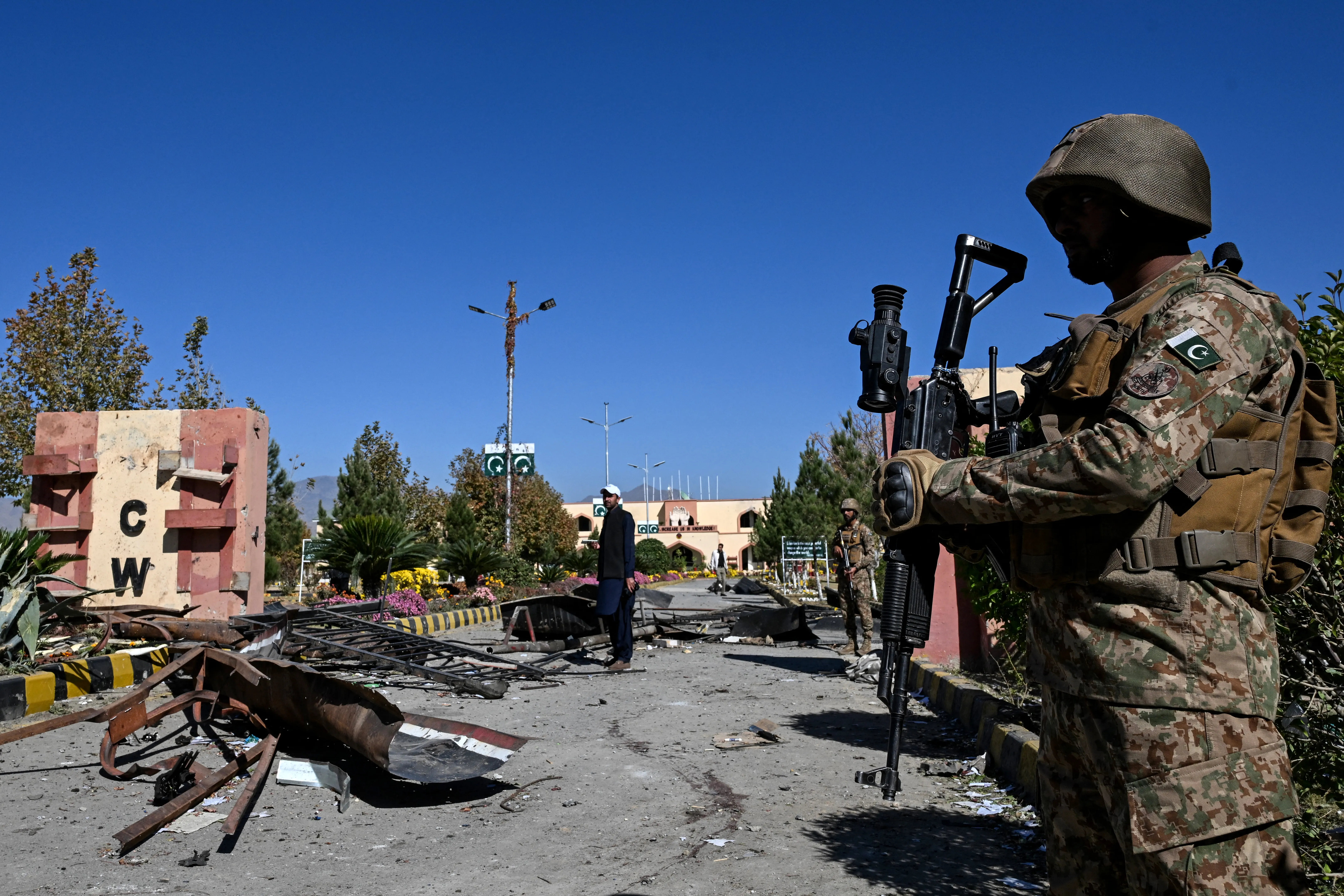 A Pakistani soldier stands guard after an attack on the Cadet College Wana in Pakistan&#039;s South Waziristan district near the Afghanistan border, on November 13, 2025 [Aamir Qureshi/AFP]