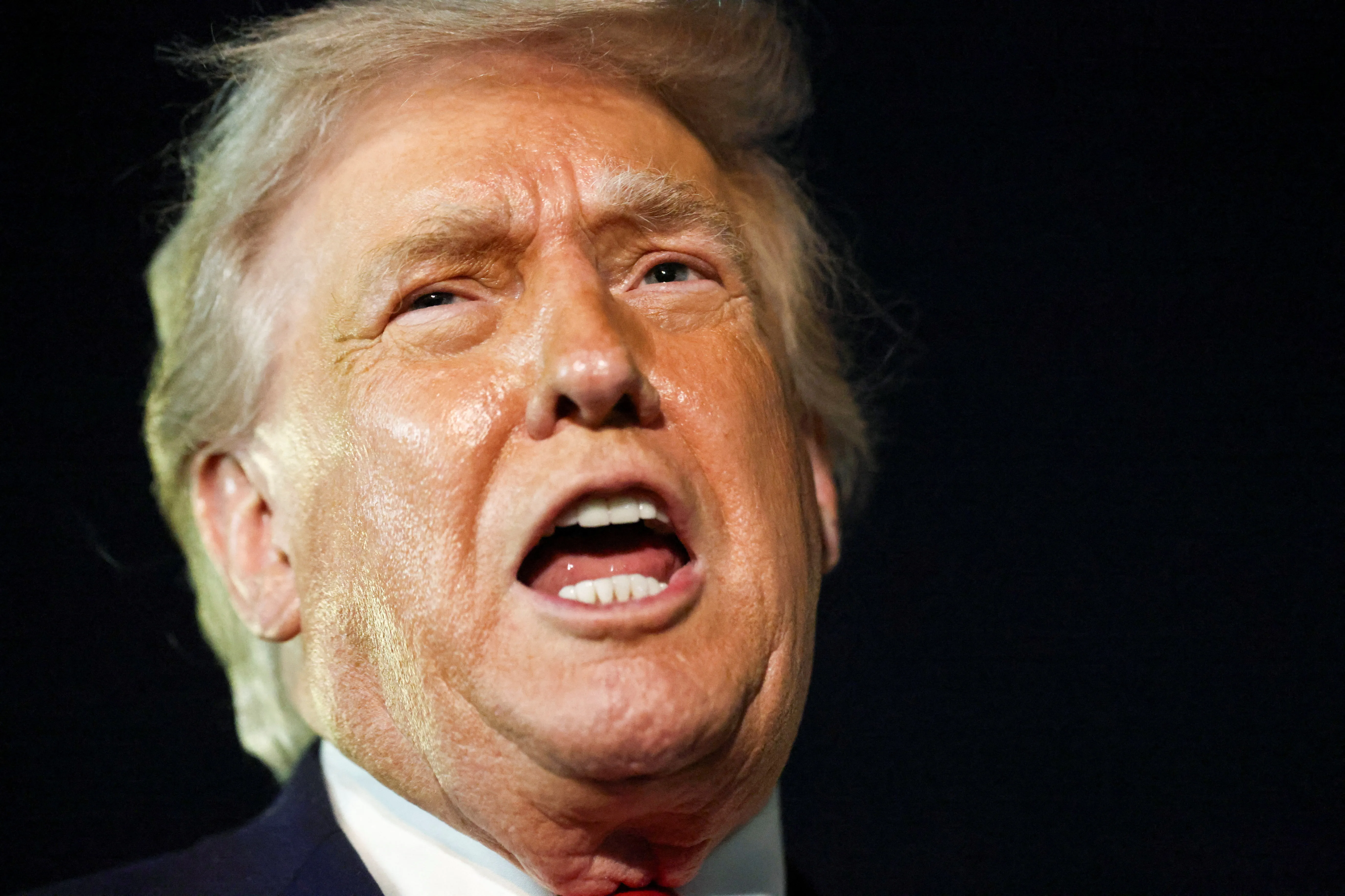 U.S. President Donald Trump speaks to members of the media ahead of boarding Air Force One to depart for Washington, at Palm Beach International Airport in West Palm Beach, Florida, U.S., January 19, 2026. REUTERS/Kevin Lamarque